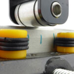 The impactor is moved along the edge to roll the edge apex. The amount of roll can then be measured.