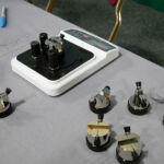 An Edge On Up Tester with multiple test fixtures.